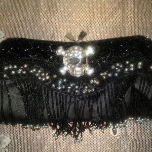 Black jeweled fringed skull clutch with rhinestone